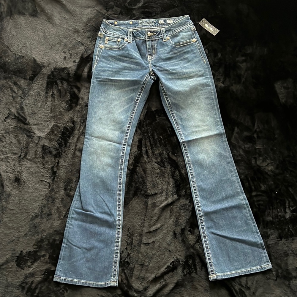 Brand new, never been worn MISS ME boot cut jeans size 28 blue silver pockets